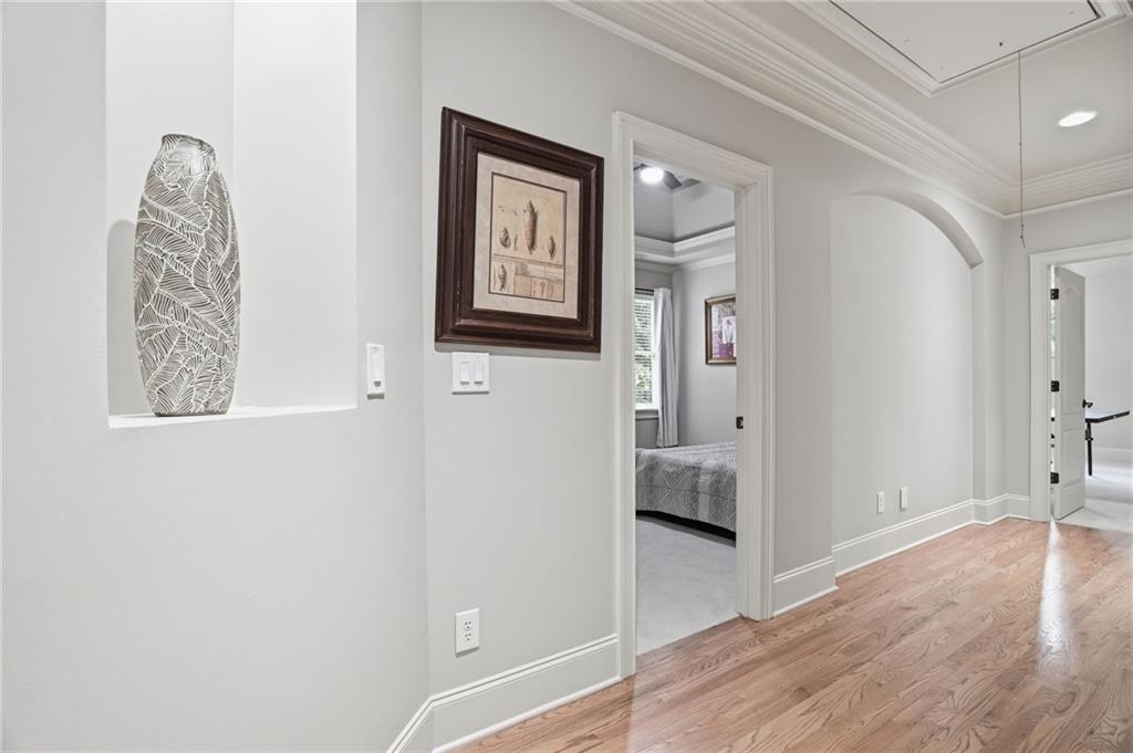 8340 Colonial Place Duluth, GA 30097 - Photo 35 of 74 a view of a hallway with wooden floor and closet