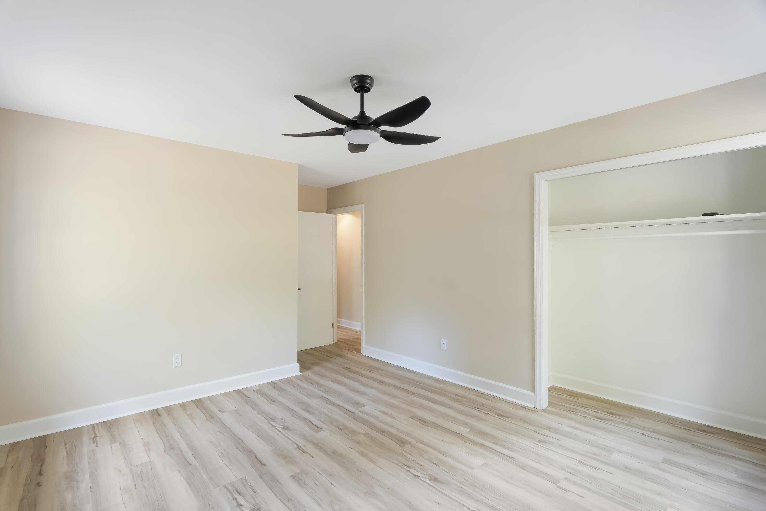 39 Gantt Street Wagener, SC 29164 - Photo 18 of 30 an empty room with wooden floor and windows