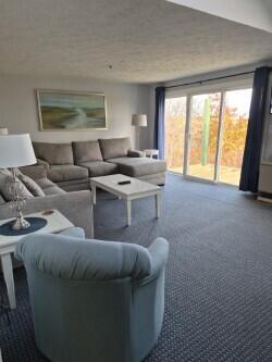 1373 Post Road, Unit 4E Wells, ME 04090 - Photo 21 of 29 4E LIVING ROOM WITH SLIDER