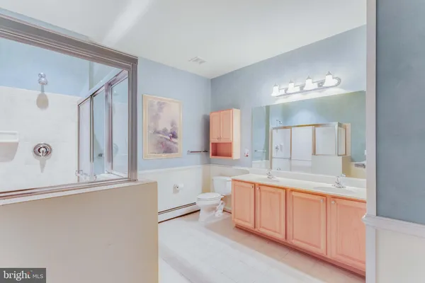 a view of a bathroom with mirror