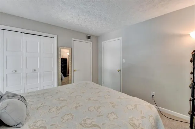 a view of a livingroom with wooden floor and closet