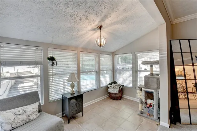 a living room with furniture and windows