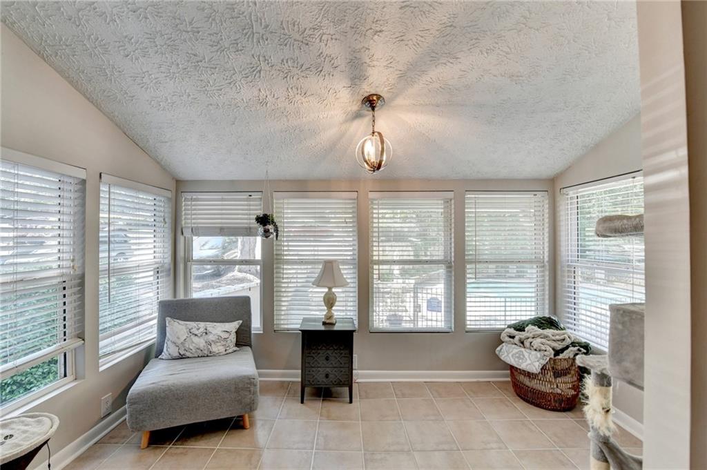 5149 Roswell Road, Unit 7 Atlanta, GA 30342 - Photo 7 of 19 a bedroom with furniture and large windows