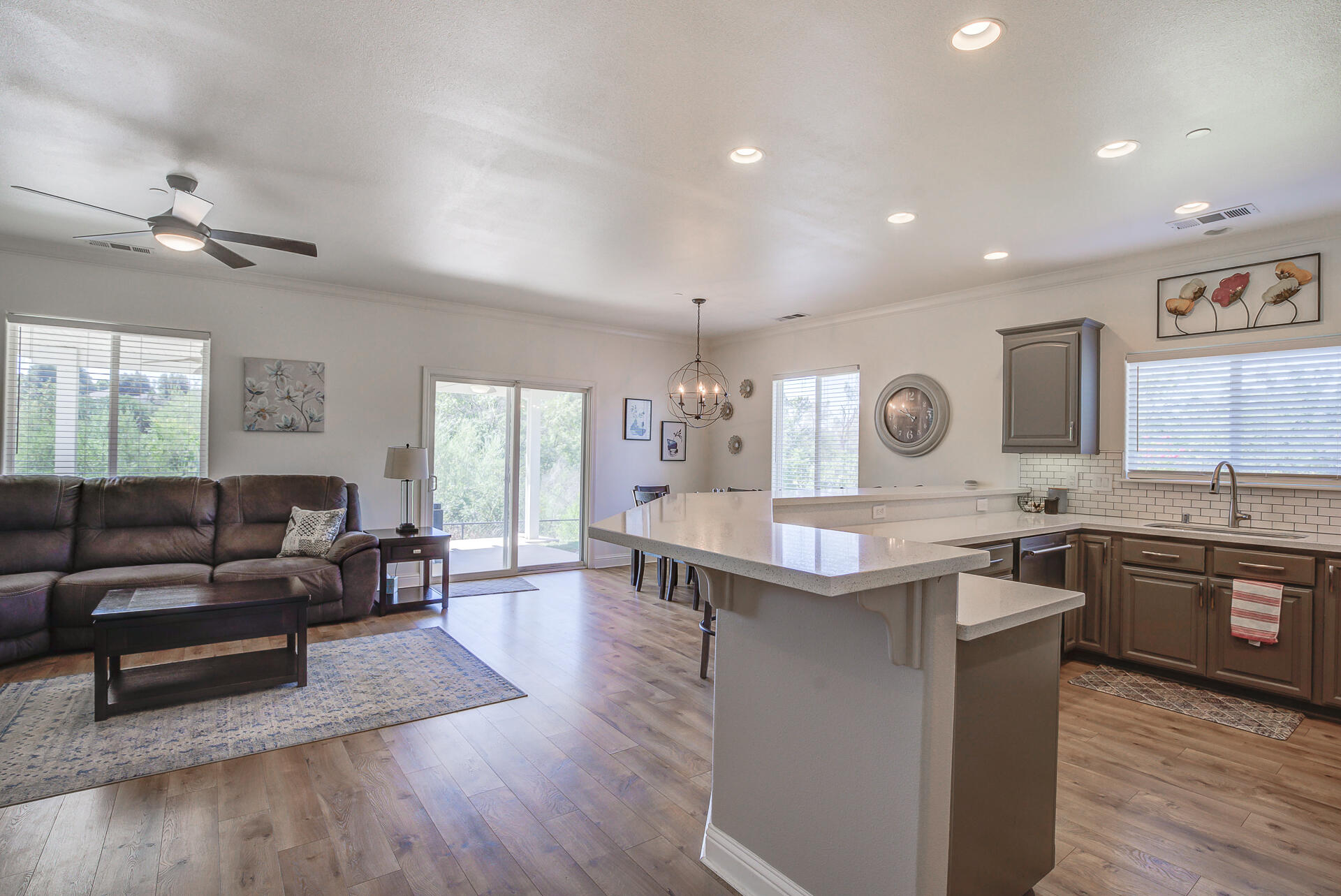 4090 Cambria Drive Redding, CA 96002 - Photo 11 of 48 a kitchen with a stove and wooden floor