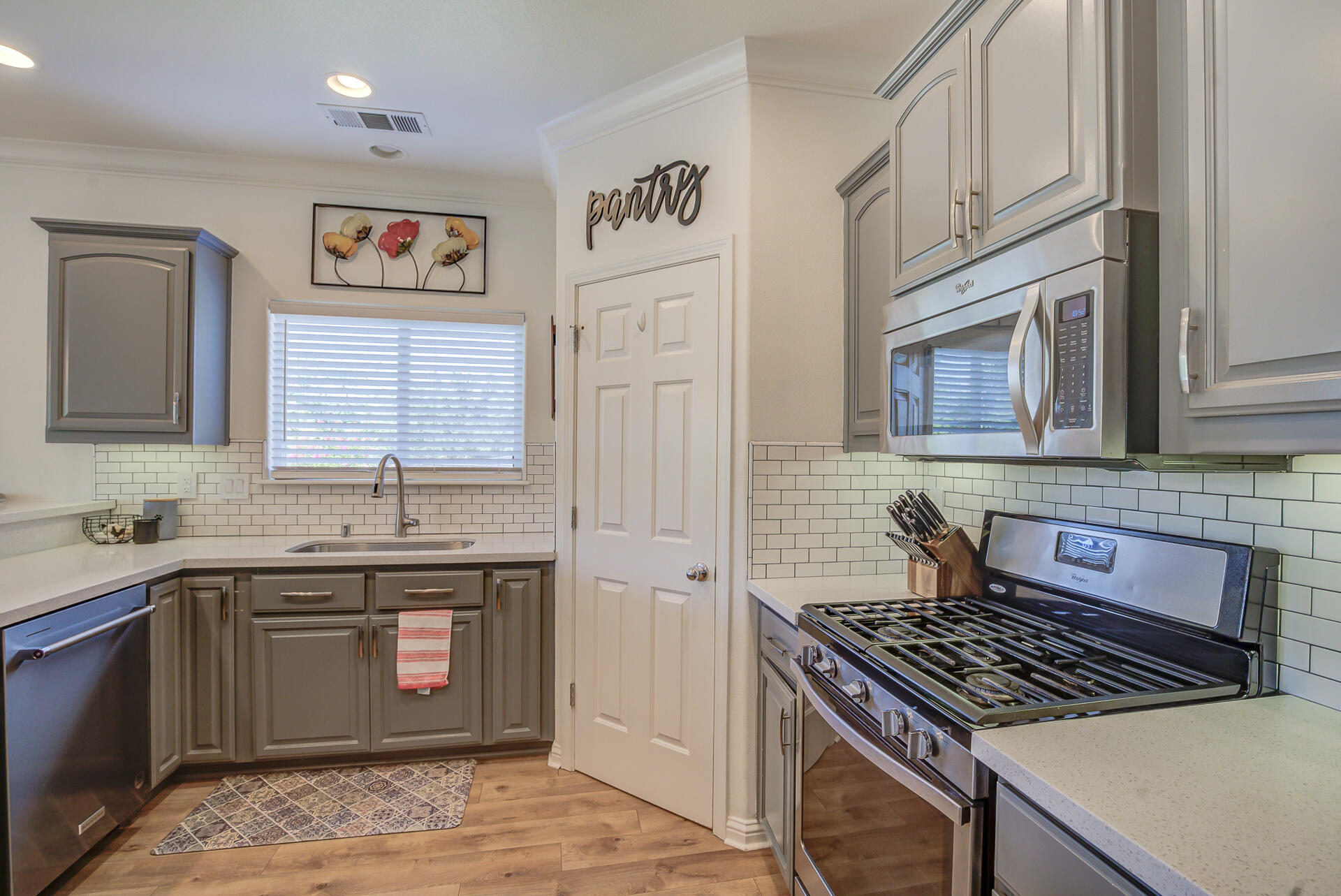 4090 Cambria Drive Redding, CA 96002 - Photo 14 of 48 a kitchen with stainless steel appliances a stove a sink and a refrigerator