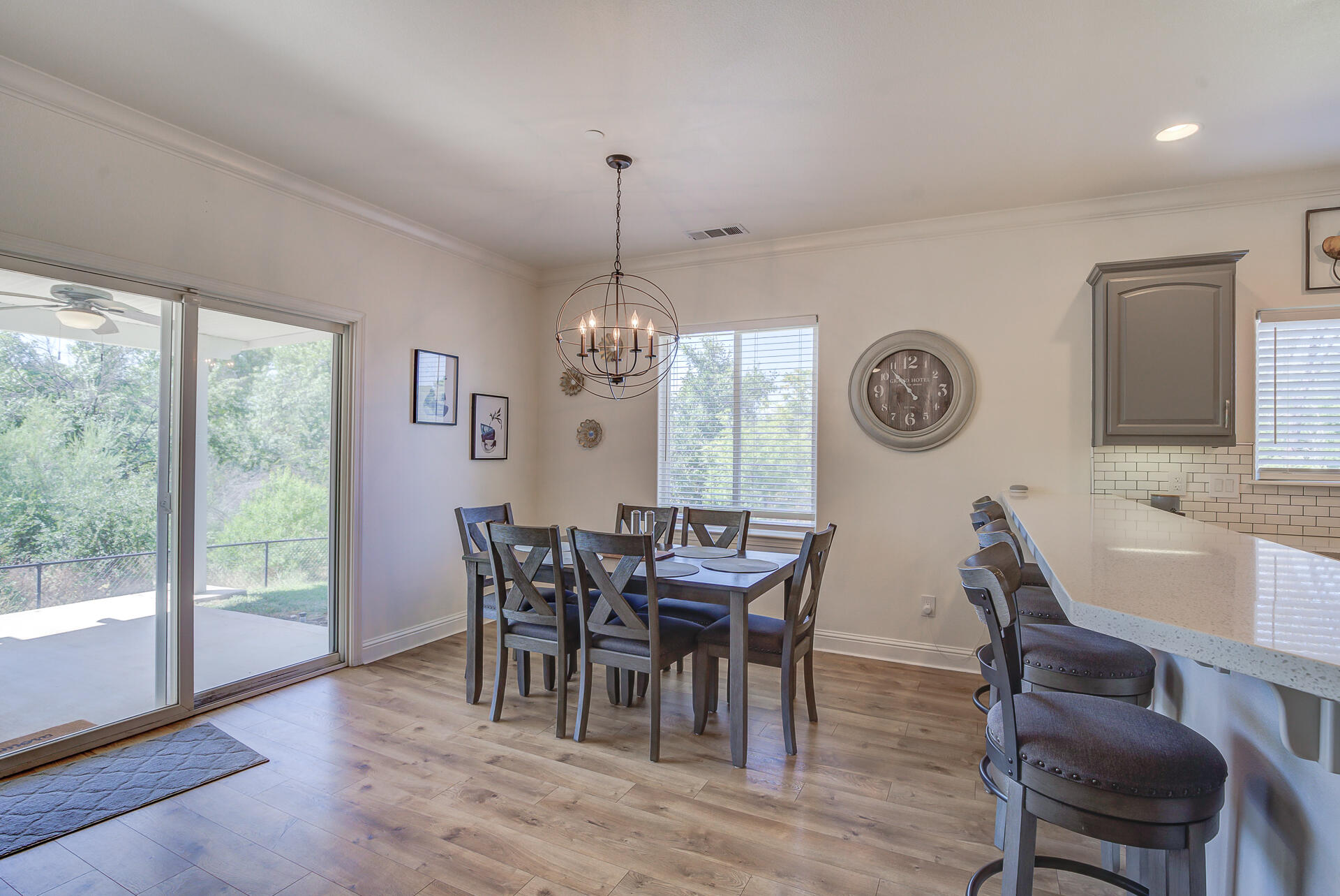 4090 Cambria Drive Redding, CA 96002 - Photo 15 of 48 a view of a dining room with furniture window and wooden floor
