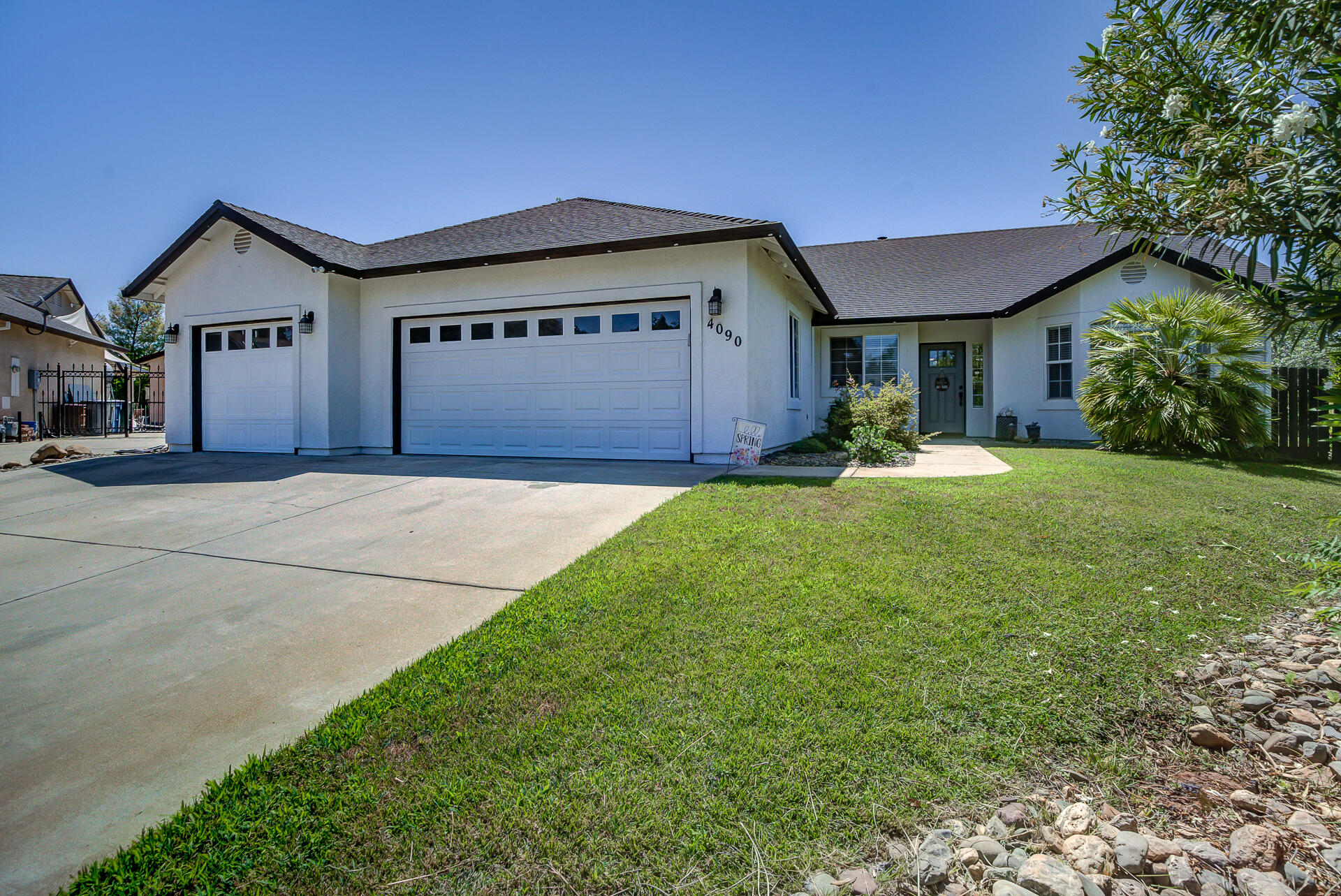 4090 Cambria Drive Redding, CA 96002 - Photo 2 of 48 a view of a house with a yard