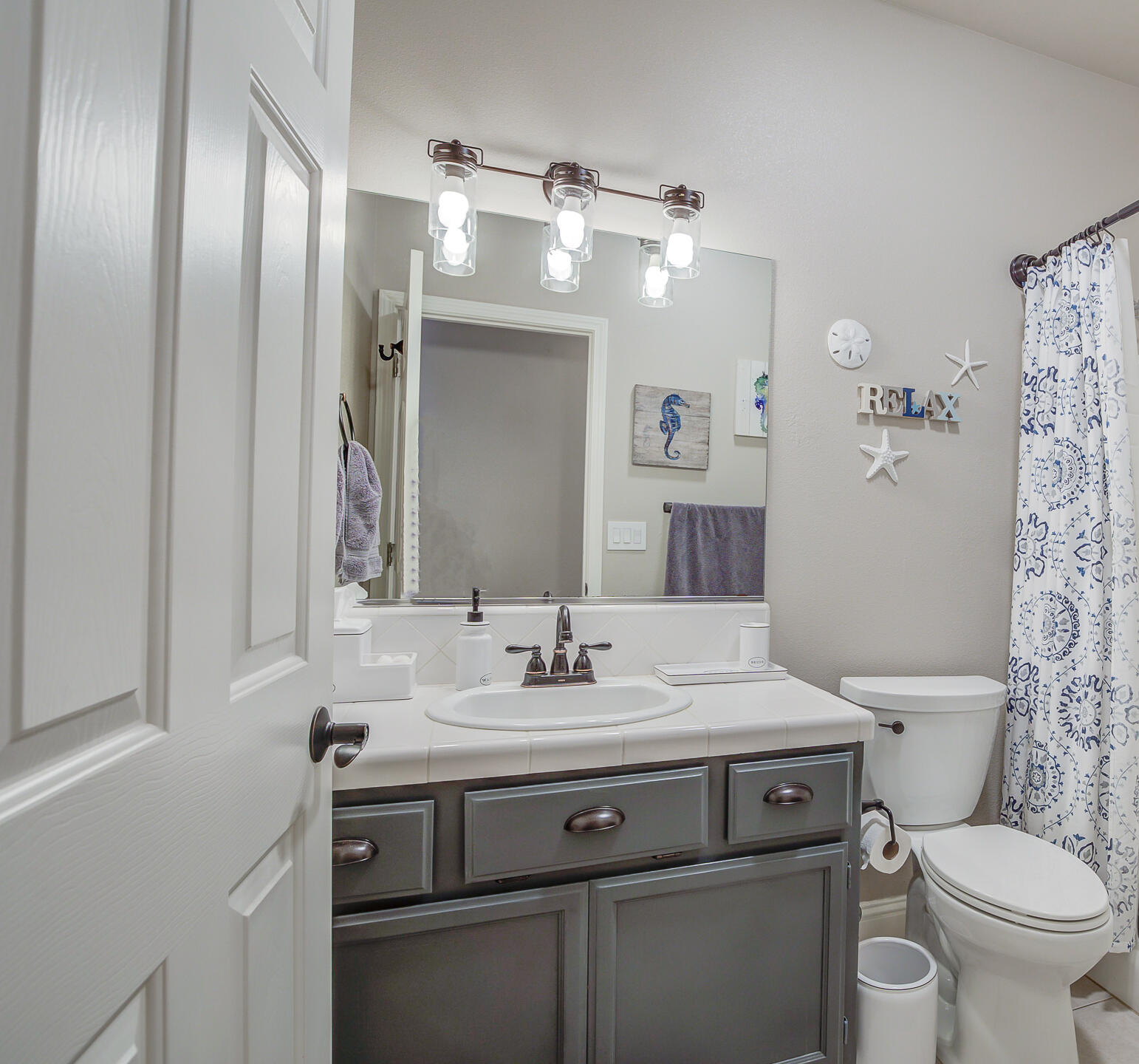 4090 Cambria Drive Redding, CA 96002 - Photo 22 of 48 a bathroom with a sink vanity mirror and toilet