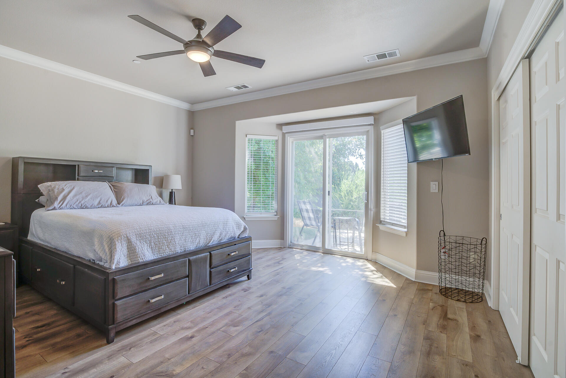 4090 Cambria Drive Redding, CA 96002 - Photo 31 of 48 a bedroom with a large bed and a chandelier