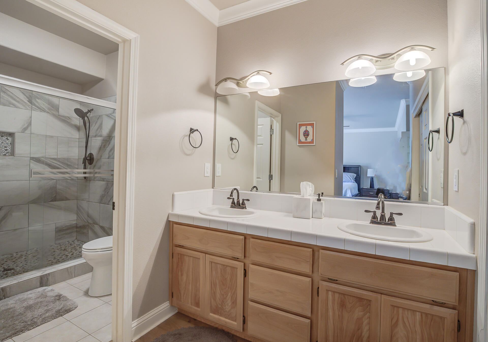 4090 Cambria Drive Redding, CA 96002 - Photo 34 of 48 a bathroom with a double vanity sink mirror and shower