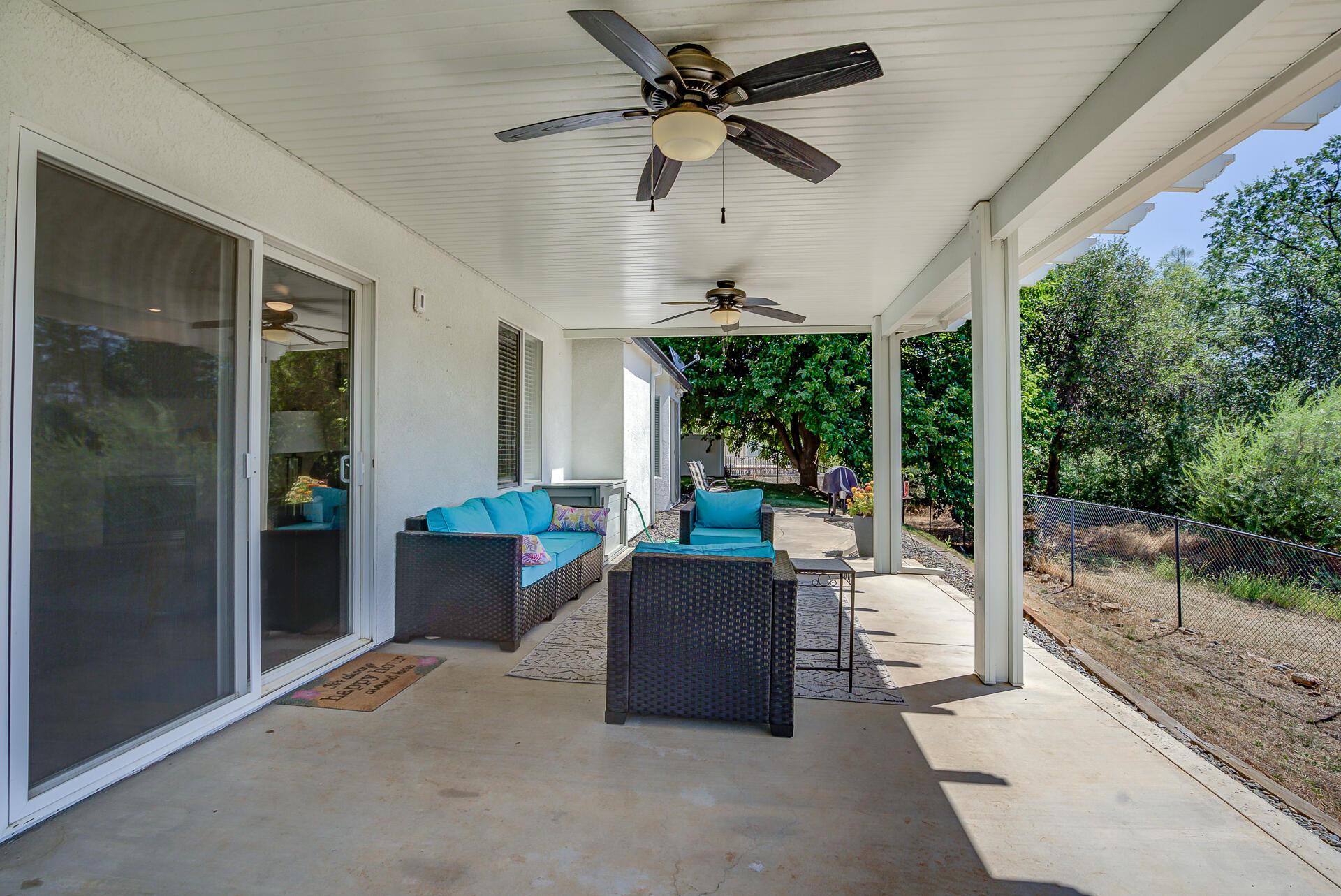 4090 Cambria Drive Redding, CA 96002 - Photo 37 of 48 a living room with patio furniture and garden view
