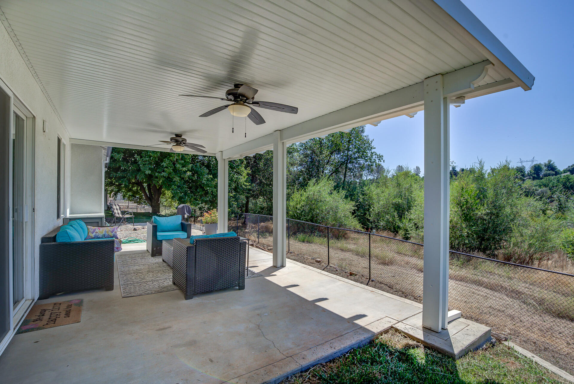 4090 Cambria Drive Redding, CA 96002 - Photo 38 of 48 a view of a patio with couches chairs and backyard