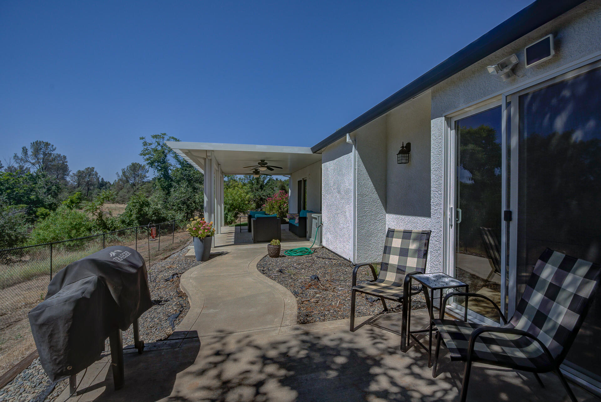 4090 Cambria Drive Redding, CA 96002 - Photo 39 of 48 a view of backyard of house with seating space