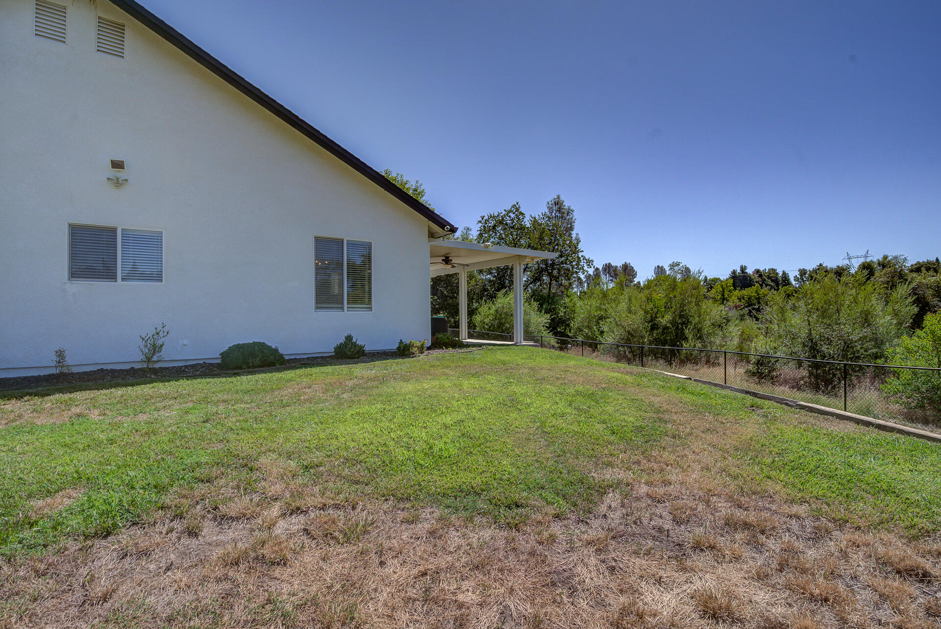4090 Cambria Drive Redding, CA 96002 - Photo 43 of 48 a backyard of a house with lots of green space