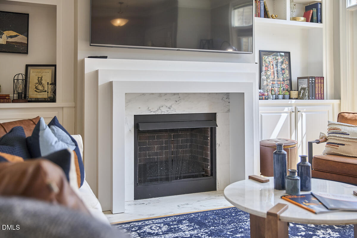 203 Valleyshire Road Durham, NC 27707 - Photo 12 of 37 a living room with furniture and a fireplace