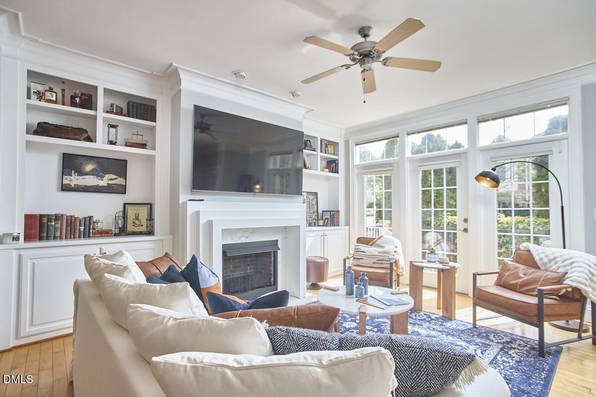 203 Valleyshire Road Durham, NC 27707 - Photo 13 of 37 a living room with furniture fireplace and flat screen tv