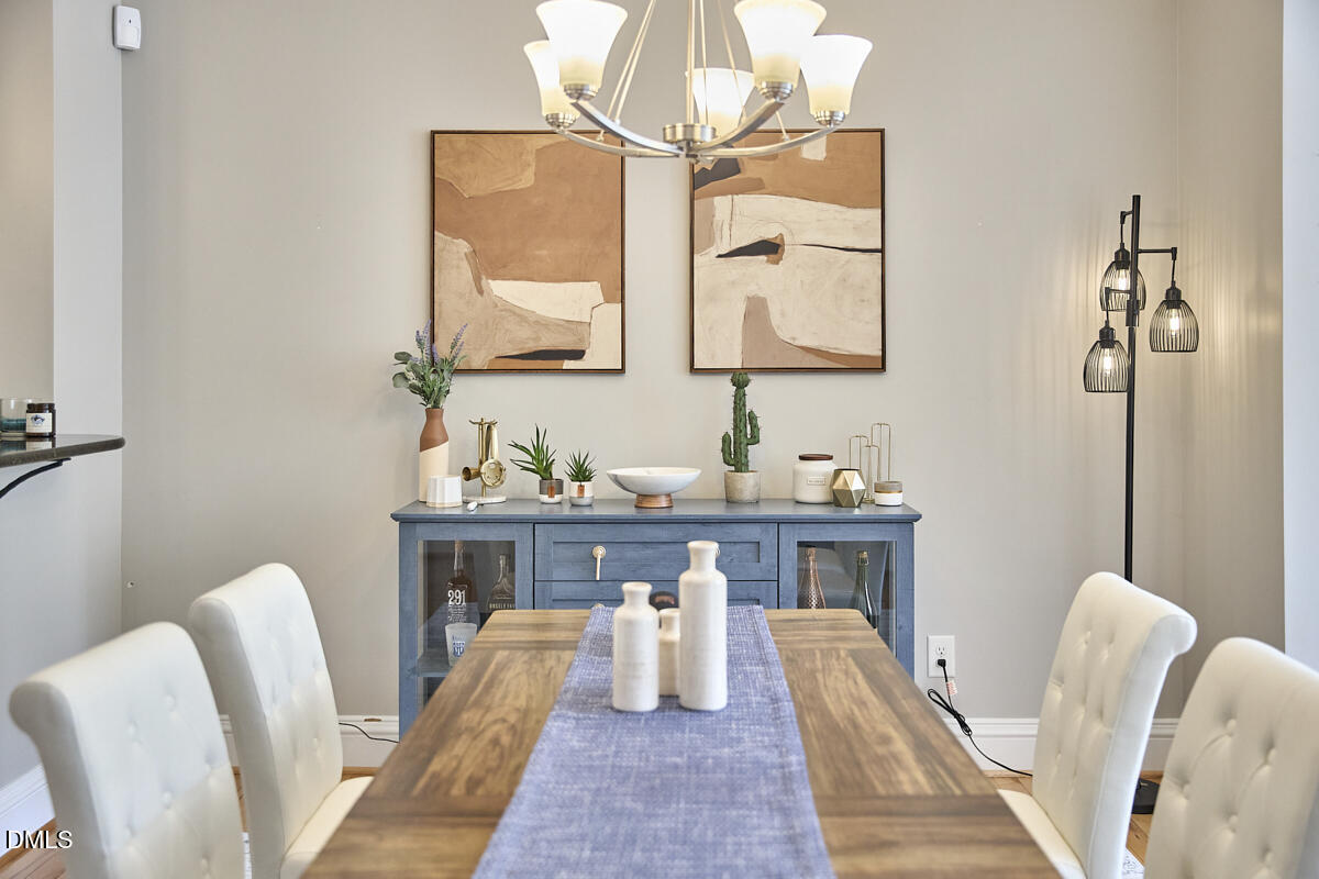 203 Valleyshire Road Durham, NC 27707 - Photo 15 of 37 a living room with furniture a table and chair