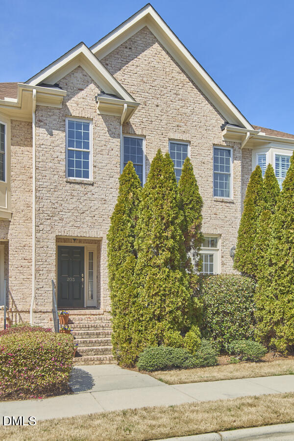203 Valleyshire Road Durham, NC 27707 - Photo 2 of 37 a front view of a house with garden
