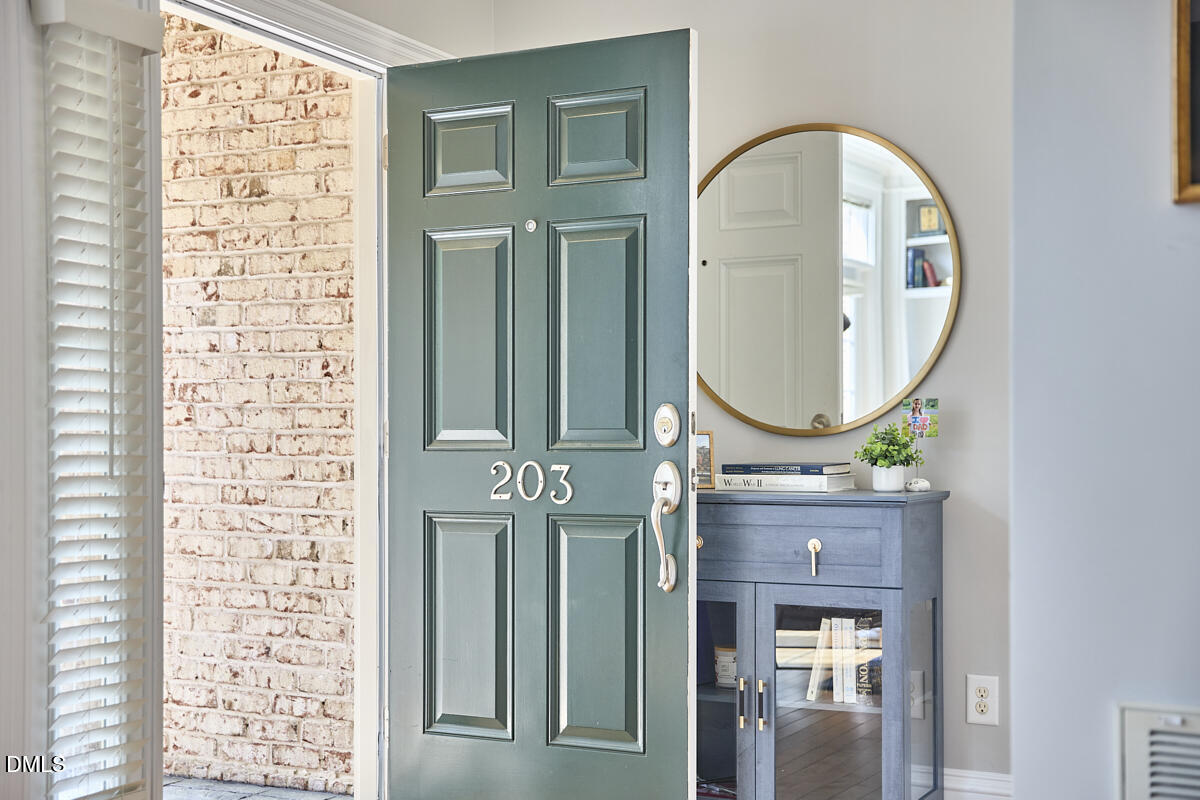 203 Valleyshire Road Durham, NC 27707 - Photo 5 of 37 a front view of a house with a garden