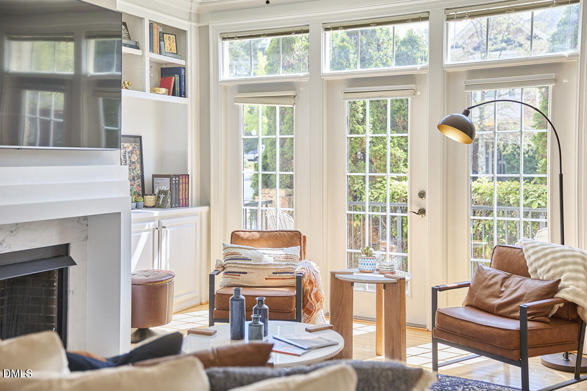 203 Valleyshire Road Durham, NC 27707 - Photo 9 of 37 a living room with furniture and a large window