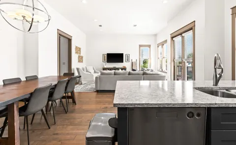 a kitchen with granite countertop lots of counter top space and dining table