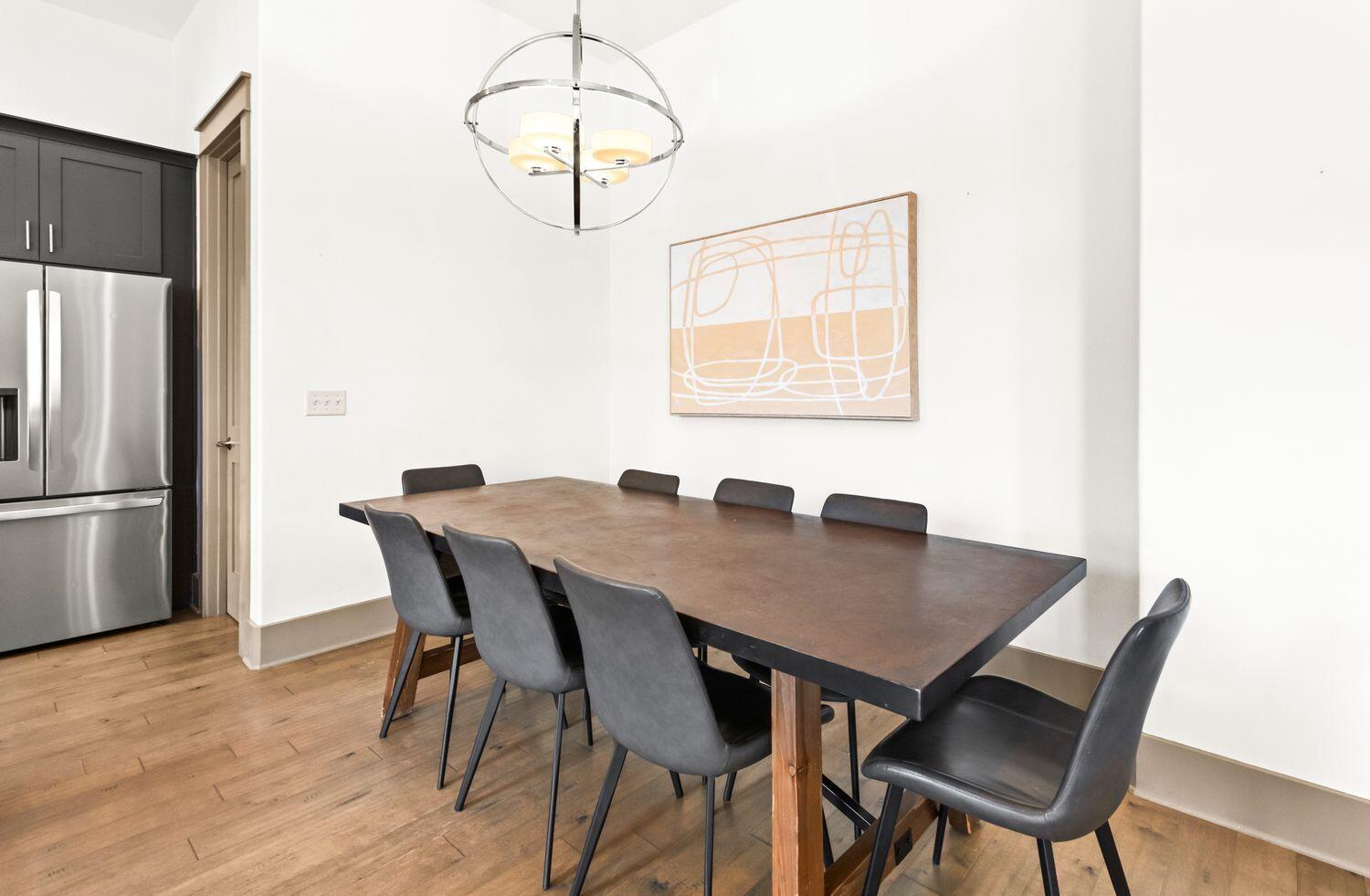 178 Woodward Drive Santa Rosa Beach, FL 32459 - Photo 14 of 29 a view of a dining room with furniture wooden floor and chandelier