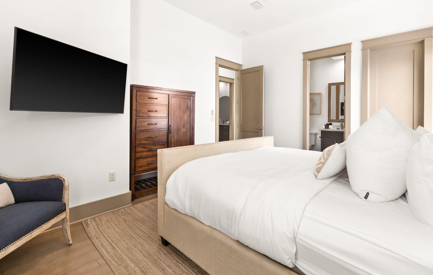 178 Woodward Drive Santa Rosa Beach, FL 32459 - Photo 23 of 29 a bedroom with a bed a tv and couch