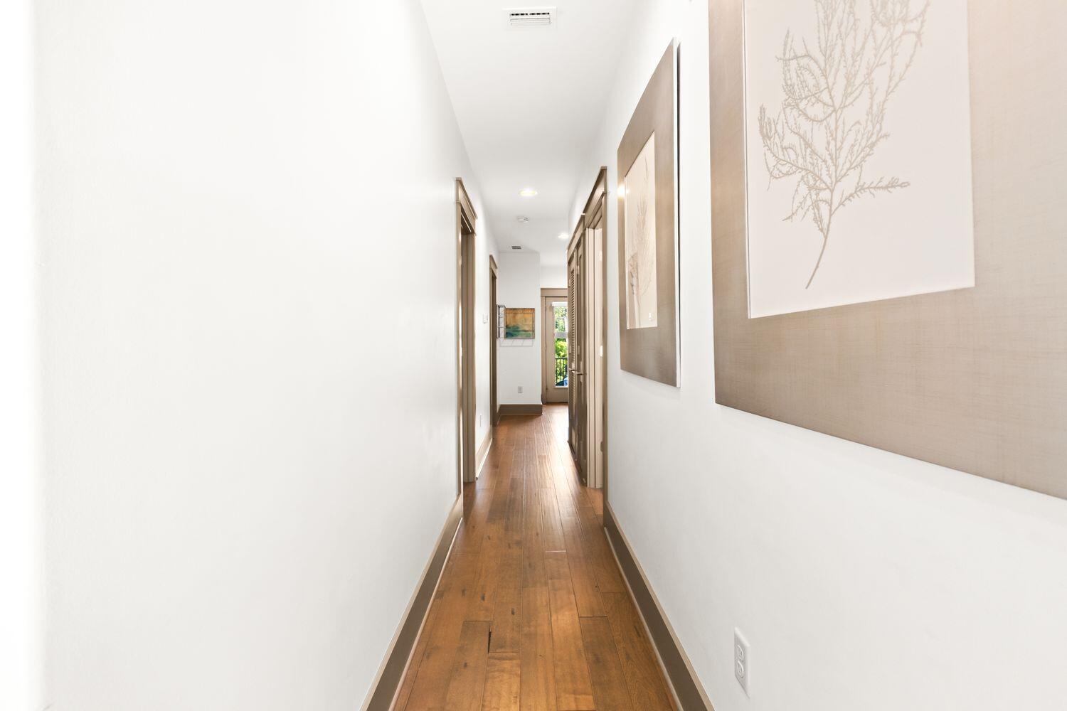 178 Woodward Drive Santa Rosa Beach, FL 32459 - Photo 24 of 29 a view of a hallway with wooden floor