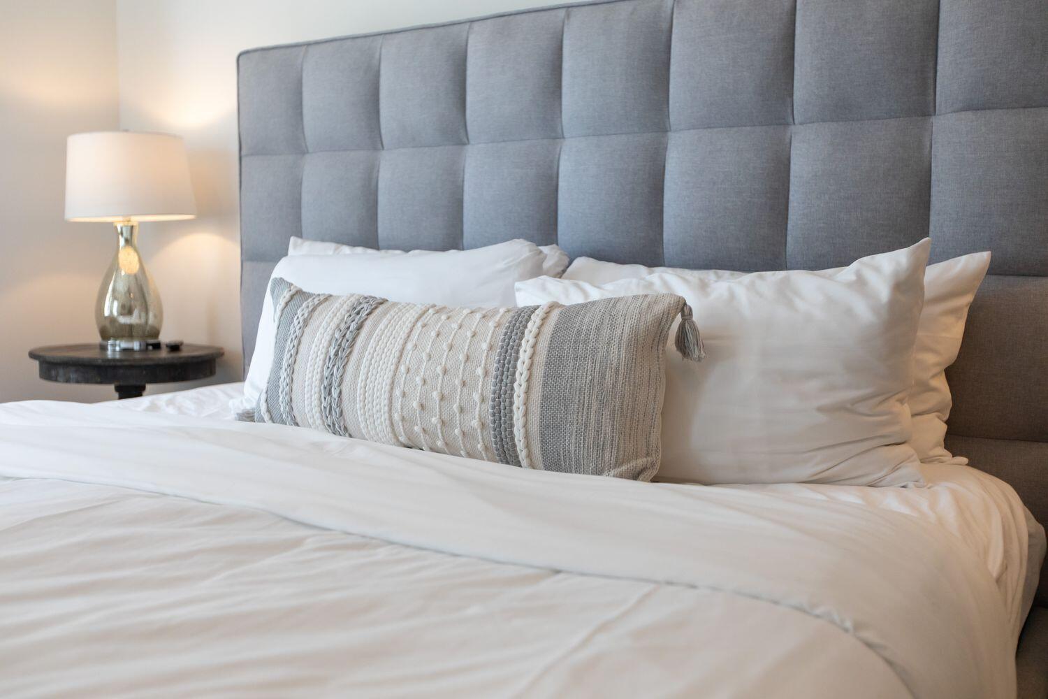 178 Woodward Drive Santa Rosa Beach, FL 32459 - Photo 26 of 29 a bedroom with a bed and a lamp