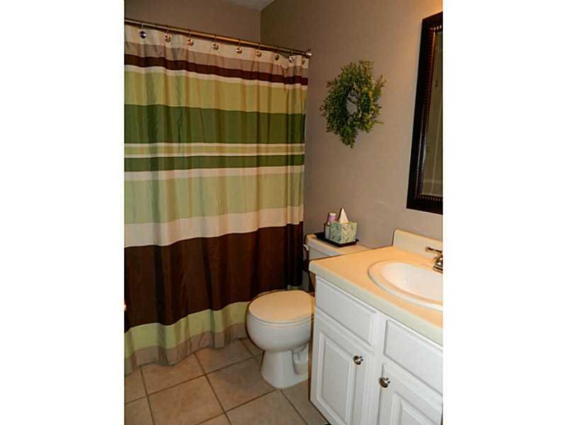 552 Country Club Road Washington, PA 15301 - Photo 12 of 25 Full Bath. The guest bath is modern with white vanity and neutral beige tile floor. A tub/shower is located here.