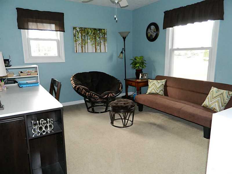 552 Country Club Road Washington, PA 15301 - Photo 17 of 25 Bedroom. Bedroom 2 is large with neutral beige carpet and warm blue paint.