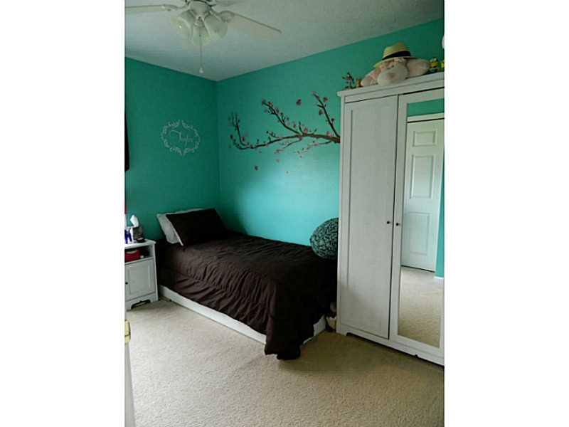 552 Country Club Road Washington, PA 15301 - Photo 18 of 25 Bedroom. Bedroom 3 is larger than it looks with neutral beige carpet and aqua accent paint.