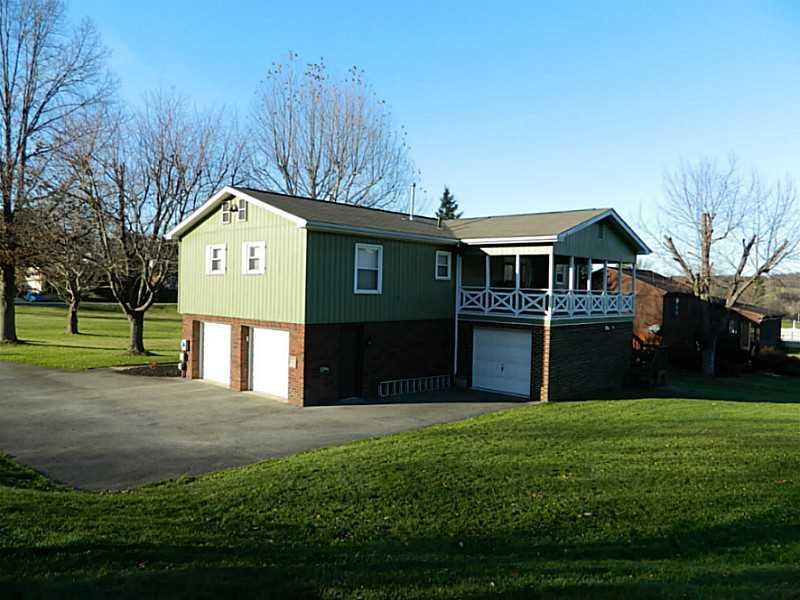 552 Country Club Road Washington, PA 15301 - Photo 3 of 25 Exterior Back. The long driveway and three garages allow for ample parking.