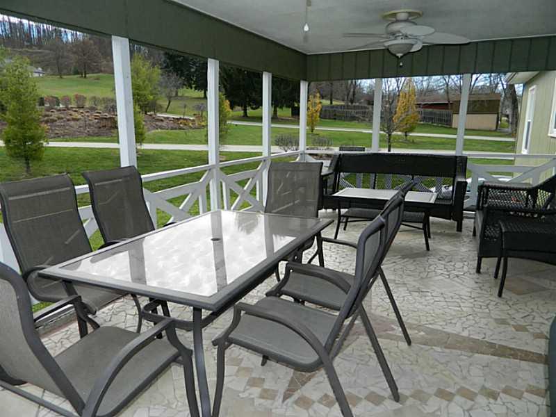 552 Country Club Road Washington, PA 15301 - Photo 24 of 25 Patio/Deck. The rear covered porch has unique mosaic tiled floor. Large enough for both dining area and sitting area.