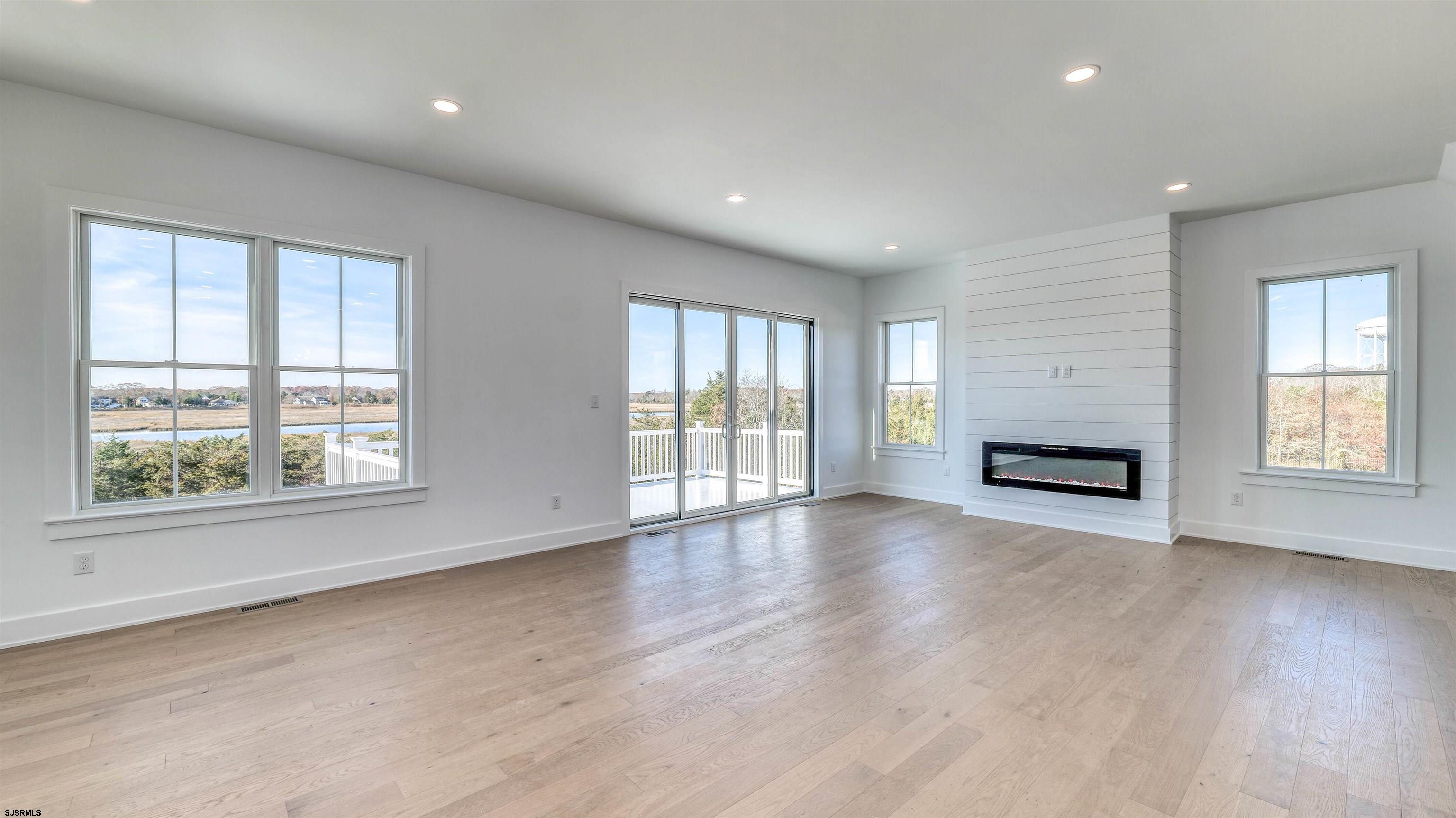 15 Creek Lane Linwood, NJ 08221 - Photo 23 of 50 an empty room with wooden floor and windows