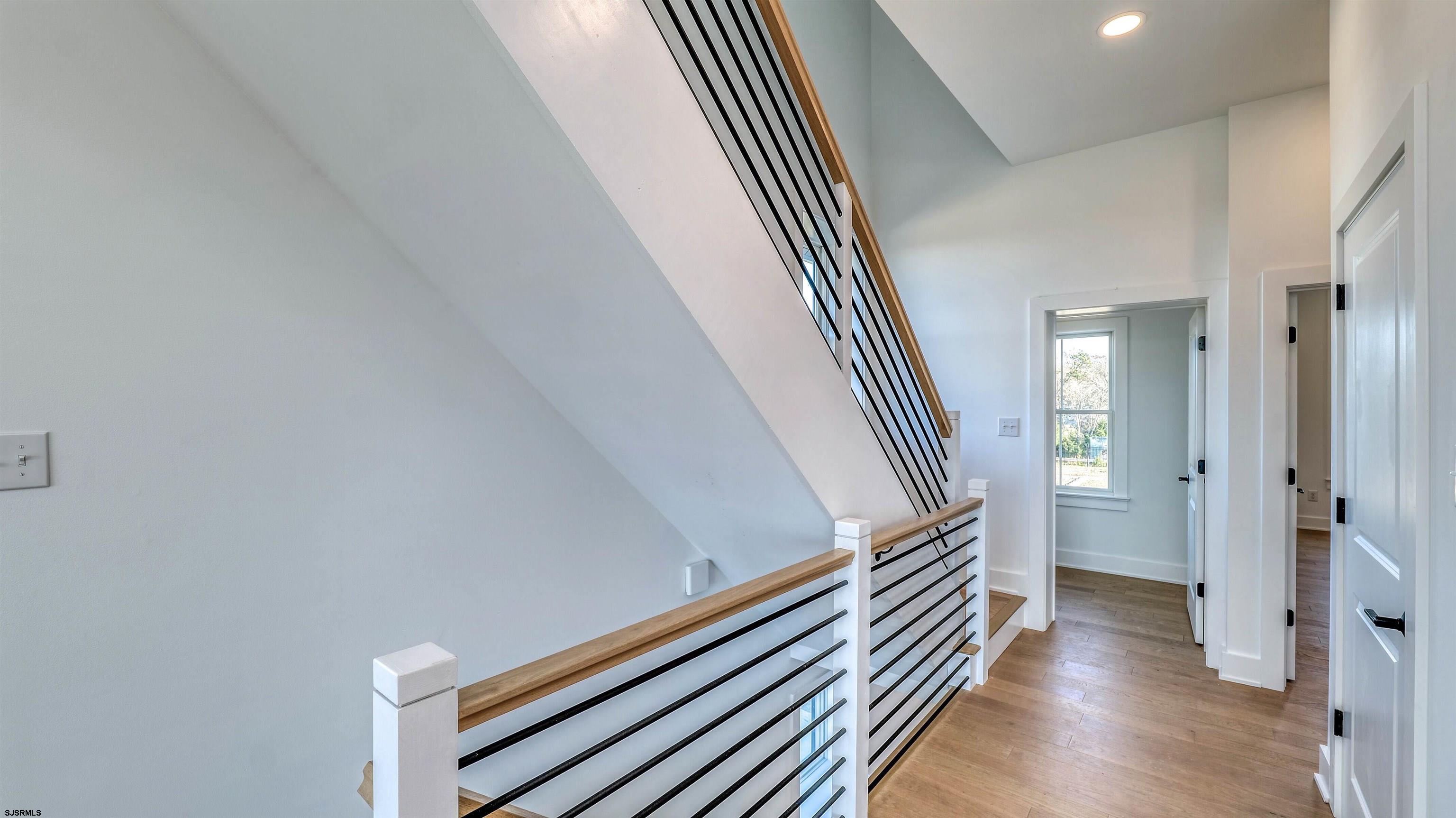 15 Creek Lane Linwood, NJ 08221 - Photo 30 of 50 a view of a hallway with wooden floor and staircase