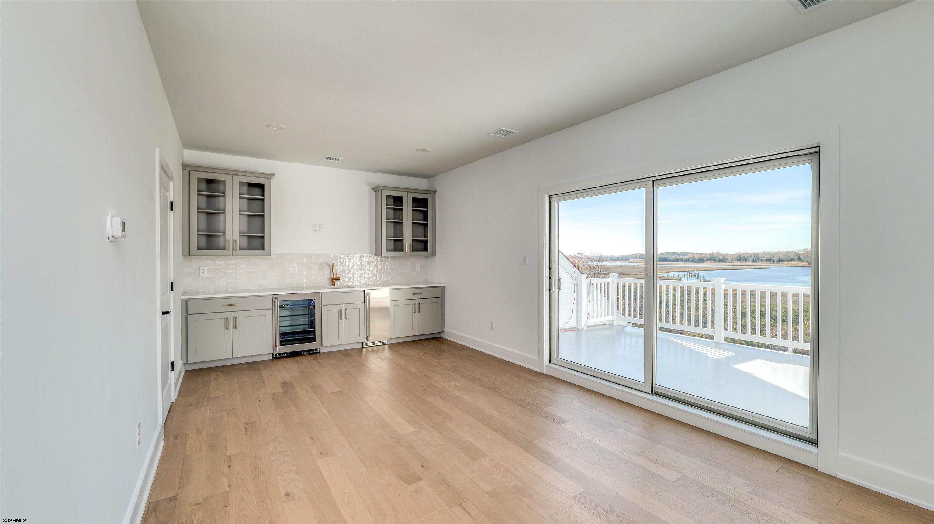 15 Creek Lane Linwood, NJ 08221 - Photo 40 of 50 a view of a big room with windows and kitchen view