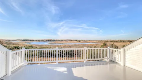 a view of a balcony with wooden floor