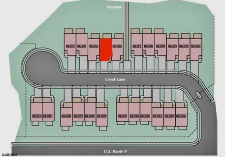 a aerial view of a house with a yard basket ball court and outdoor seating