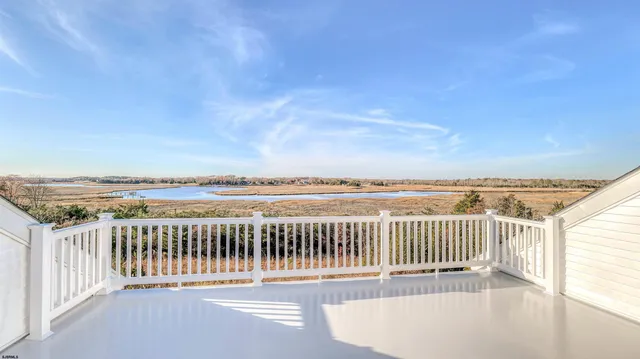 a view of a balcony with wooden floor
