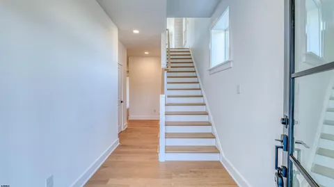 a view of a hallway with stairs