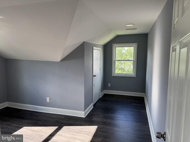 3811 Barrington Road Baltimore, MD 21215 - Photo 28 of 50 wooden floor in an empty room with a window