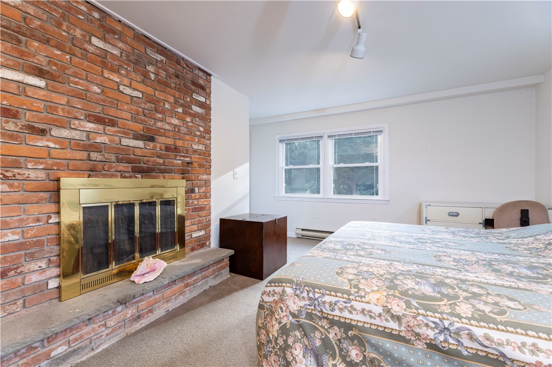 19 Happy Valley Road Westerly, RI 02891 - Photo 42 of 45 lower level guest sweet with fire place