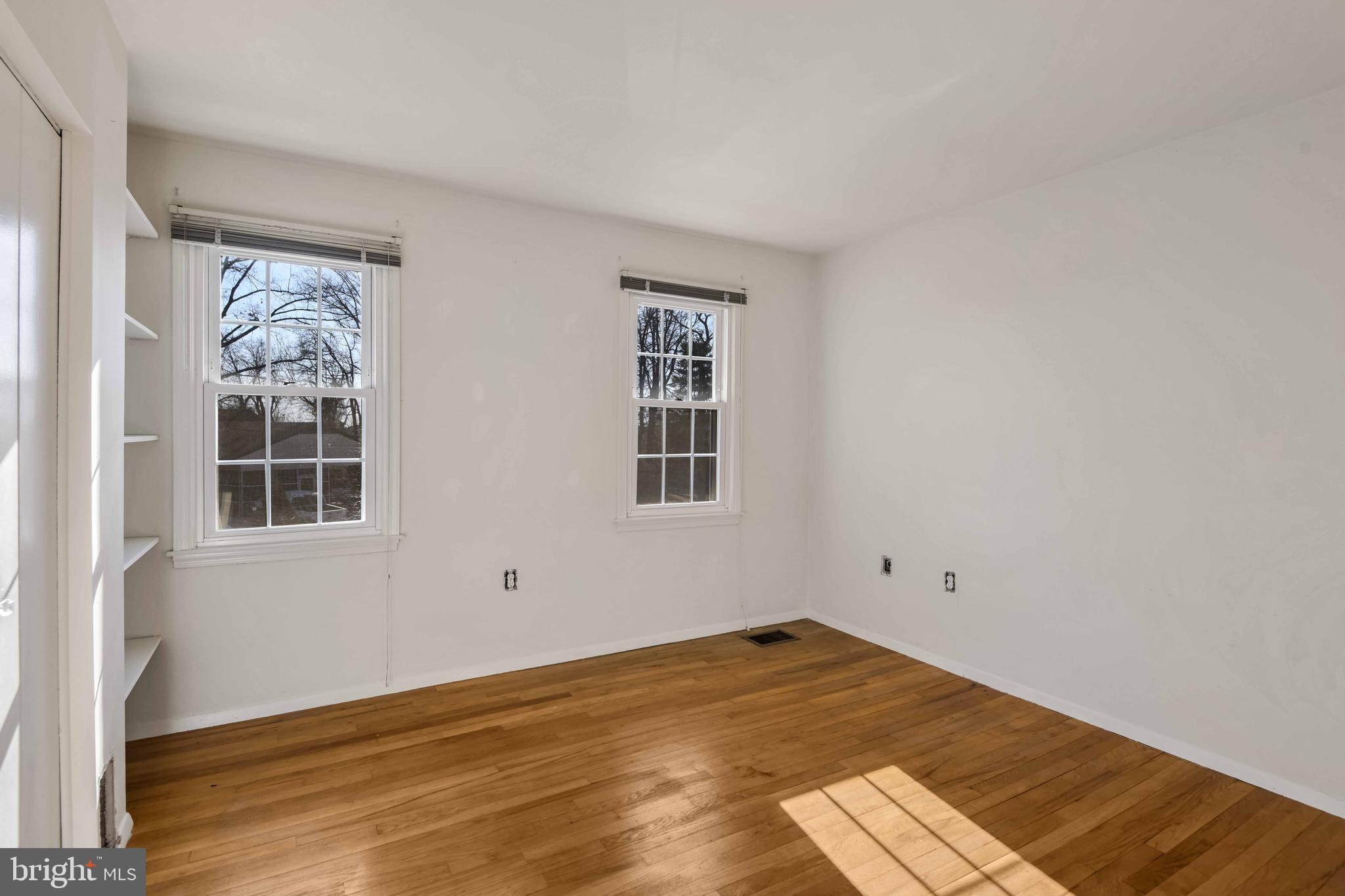 8310 Nightingale Drive Greenbelt, MD 20770 - Photo 15 of 27 a view of empty room with wooden floor and fan