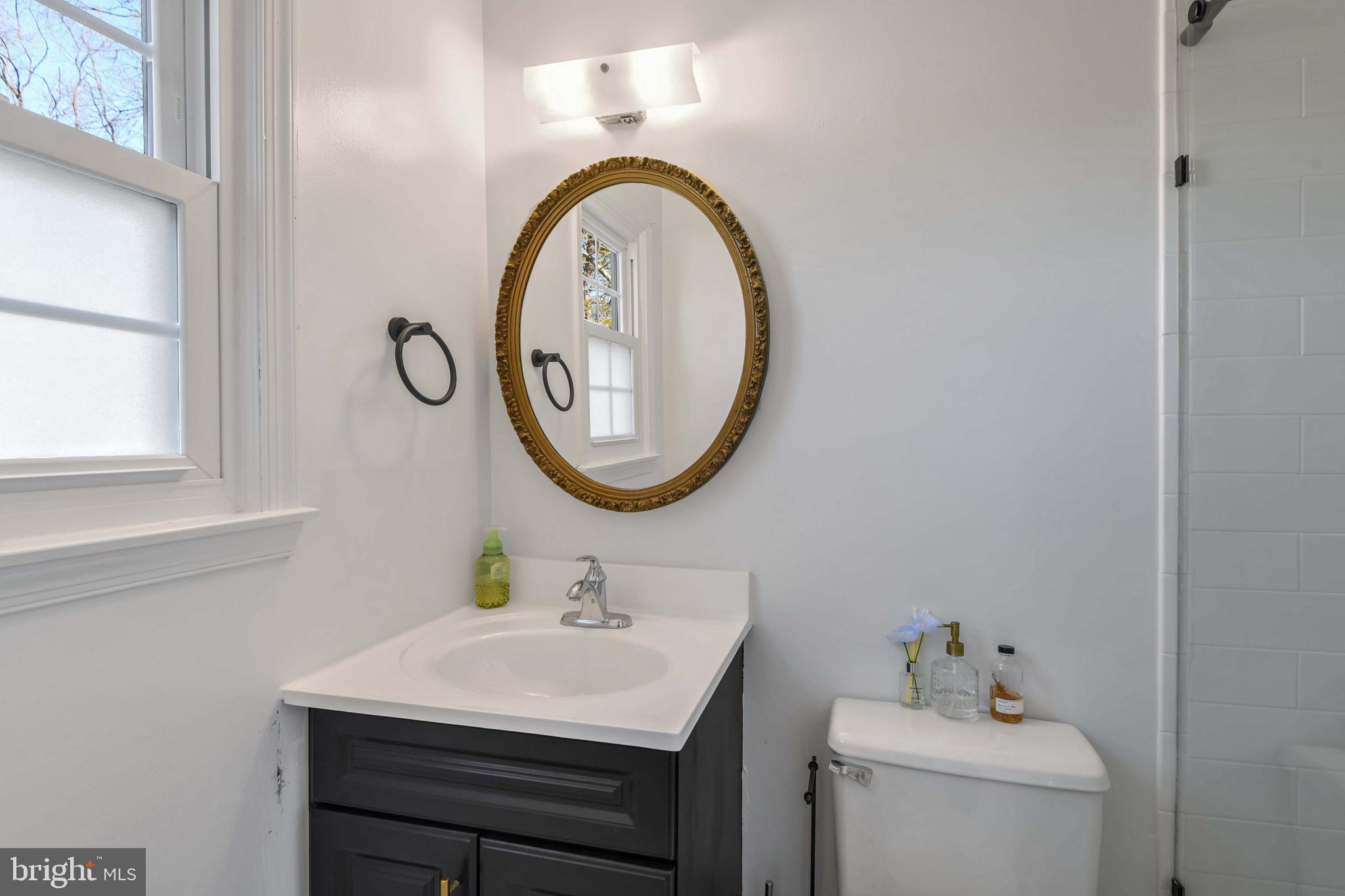 8310 Nightingale Drive Greenbelt, MD 20770 - Photo 19 of 27 a bathroom with a sink and a mirror