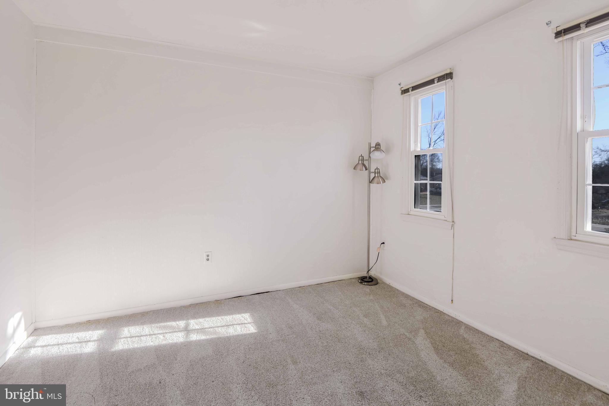 8310 Nightingale Drive Greenbelt, MD 20770 - Photo 21 of 27 an empty room with windows