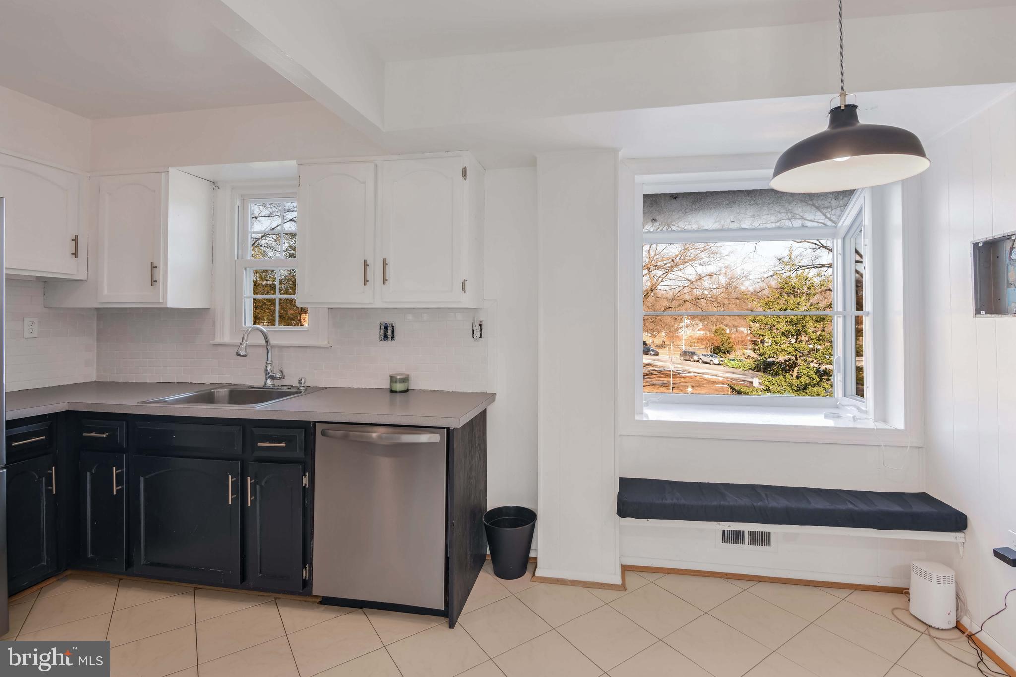 8310 Nightingale Drive Greenbelt, MD 20770 - Photo 10 of 27 a kitchen with a sink and cabinets