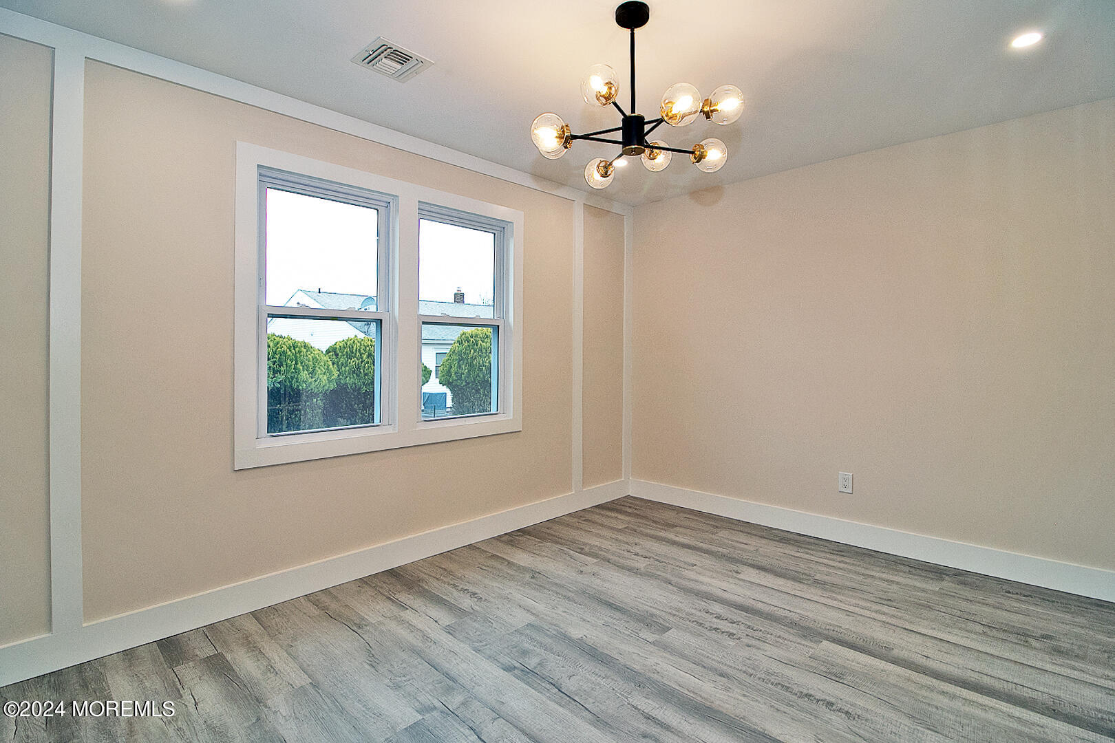 9 Mapleton Road Toms River, NJ 08757 - Photo 34 of 58 a view of an empty room with wooden floor and a window