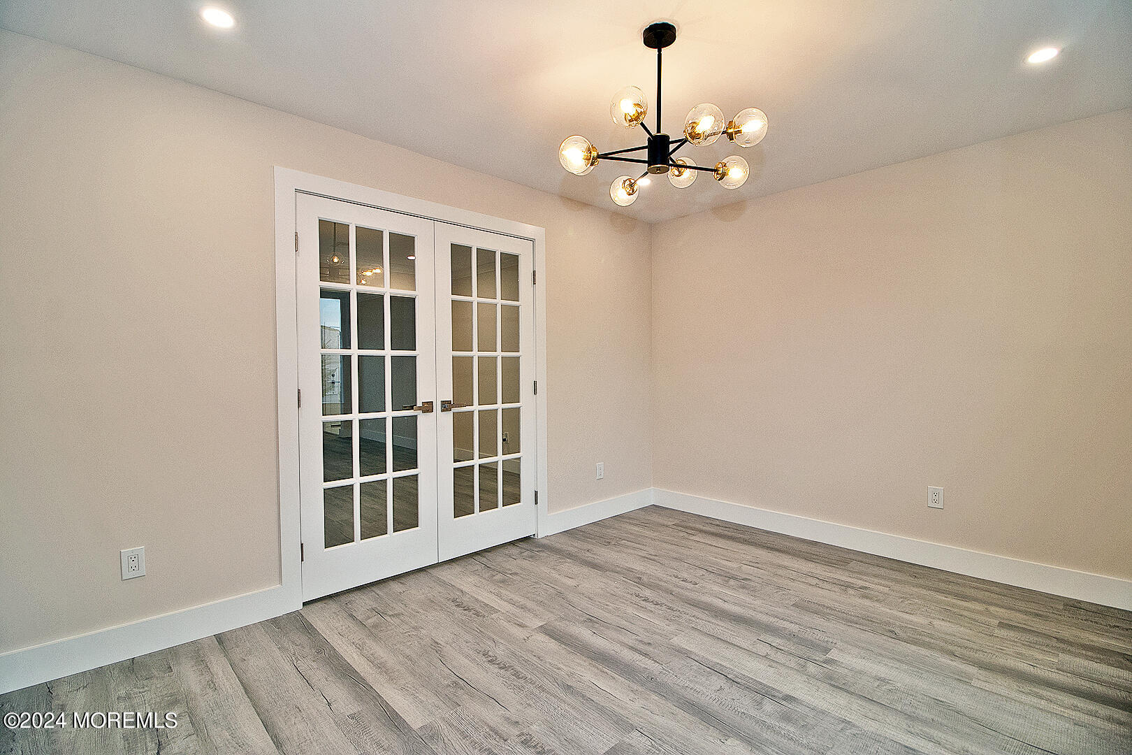 9 Mapleton Road Toms River, NJ 08757 - Photo 35 of 58 a view of empty room with wooden floor and fan