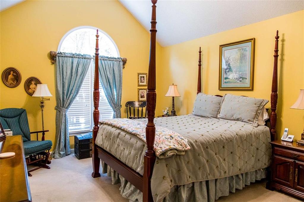 106 Eden Drive Northwest Rome, GA 30165 - Photo 12 of 23 a bedroom with a bed and a mirror